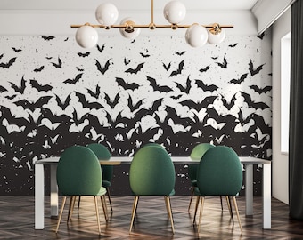 May include: A dining room featuring a white table and six green chairs. The wall is adorned with a black and white bat design. A modern chandelier hangs above the table, adding a touch of elegance.