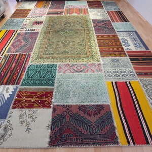 May include: A patchwork rug made from different pieces of fabric in various colors and patterns. The rug is rectangular and has a variety of colors, including red, blue, green, yellow, and white.