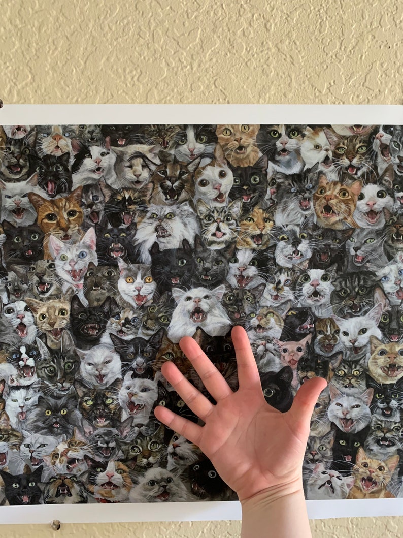 May include: A poster featuring a close-up of dozens of cats' faces, all with their mouths open as if meowing. The cats are of various breeds and colours, and the background is a dark, mottled pattern.