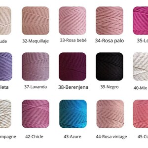 May include: A collection of 15 different colors of cotton cord, each wound into a ball. The colors include nude, pink, lavender, purple, burgundy, black, white, champagne, coral, and blue.