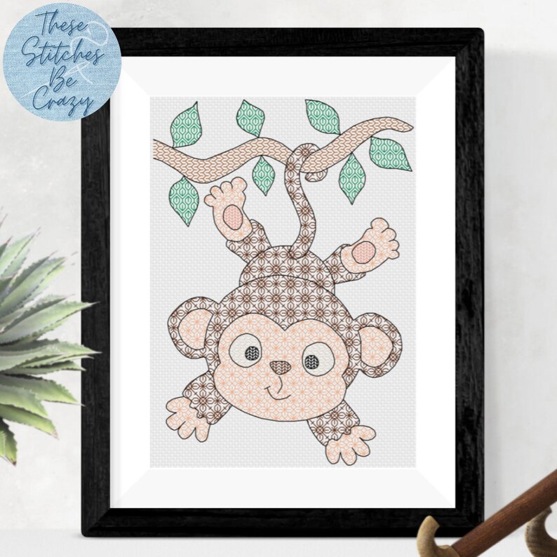 blackwork pattern of a cheeky brown monkey with big ears hanging upside down by the tail from a tree branch with green leaves with intricate fill patterns