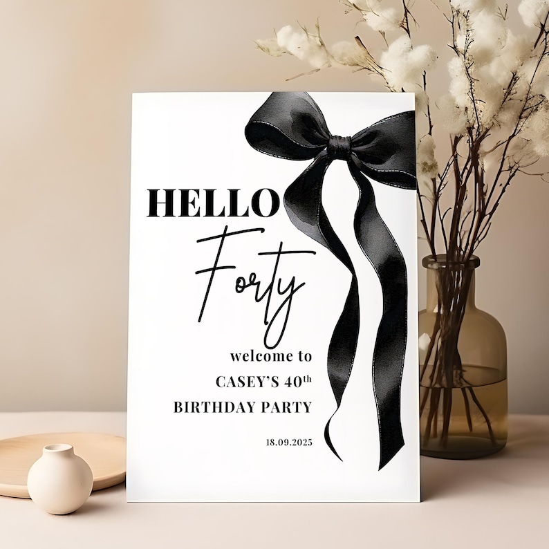 May include: Black and white printable sign with a black bow and the text "Hello Forty" and "Casey's 40th Birthday Party" with the date "18.09.2025".