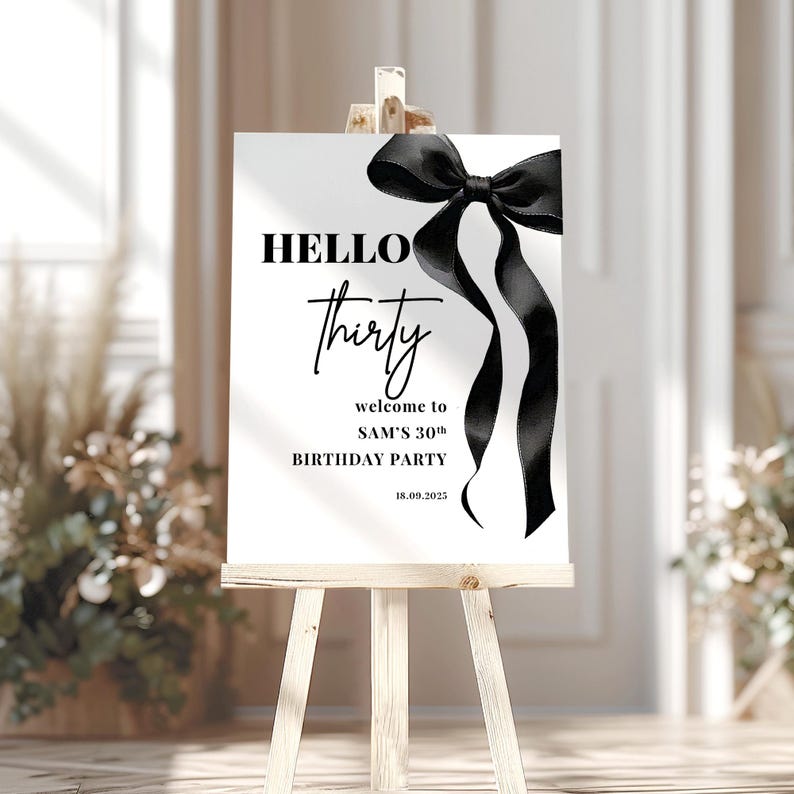 May include: Black and white welcome sign with a black bow and the text "HELLO thirty welcome to SAM'S 30th BIRTHDAY PARTY 18.09.2023"