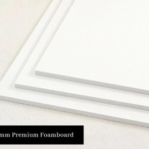 May include: Three white foam boards stacked on top of each other. The top board is the largest, and the bottom board is the smallest. The boards are 5mm thick. 5mm Premium Foamboard.