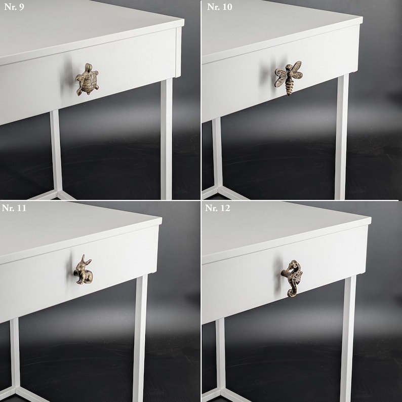 May include: Four white bedside tables with decorative drawer pulls. Each table has a different bronze-colored pull: a turtle, a bee, a rabbit, and a seahorse. The tables have a minimalist design with white legs.