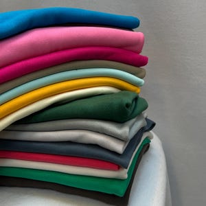 100% bawełniana dzianina interlock jersey, dzianina czesana bawełna, miękki, elastyczny materiał odzieżowy, gładka bawełniana dzianina odzieżowa 185 gsm