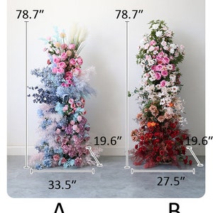 May include: Two floral arrangements, one in shades of blue and pink, the other in shades of red and pink. Both arrangements are 78.7 inches tall and are displayed against a white wall. The blue and pink arrangement is 33.5 inches wide and 19.6 inches deep. The red and pink arrangement is 27.5 inches wide and 19.6 inches deep. The arrangements are labeled A and B.