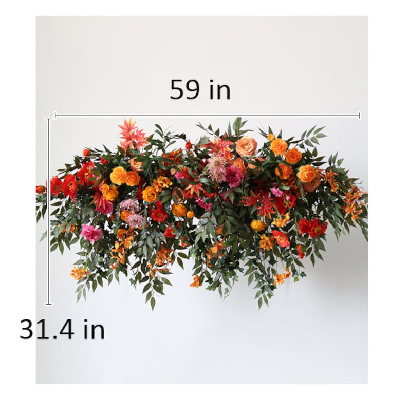May include: A floral garland with orange, red, and pink flowers and green leaves. The garland is 59 inches wide and 31.4 inches long.