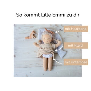 Im Lieferumfang ist die Puppe mit Kleidung enthalten