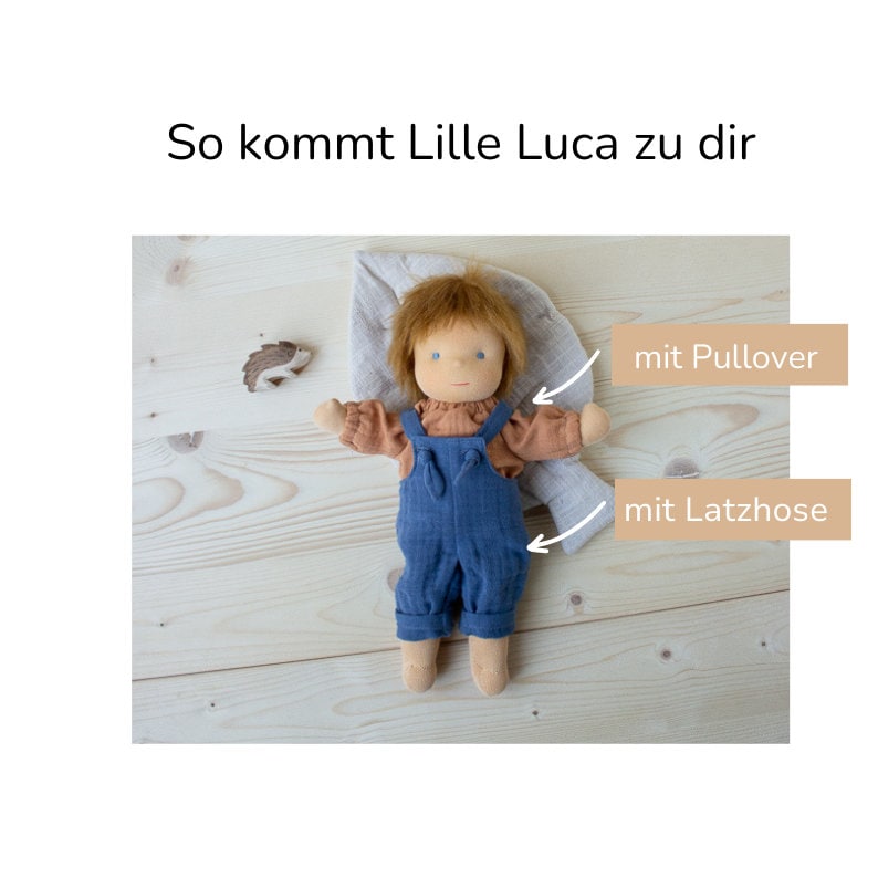 Im Lieferumfang ist die Puppe mit Kleidung enthalten