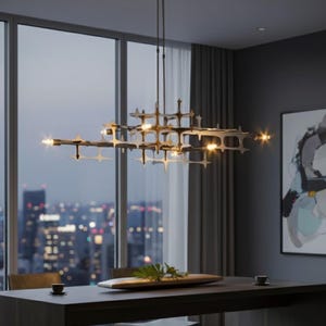 May include: A modern, geometric chandelier with multiple lights hangs above a dining table. The fixture has a complex, open design with star-shaped elements. The room features a large window with a city view and a contemporary painting on the wall.