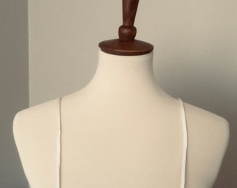 Detachable soft satin spaghetti straps.