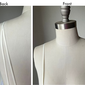 Detachable straps.  Light ivory satin spaghetti straps.  2 straps in the back