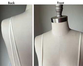Detachable straps.  Light ivory satin spaghetti straps.  2 straps in the back