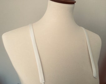 Detachable straps. Light ivory 1/2 inch wide ,soft satin