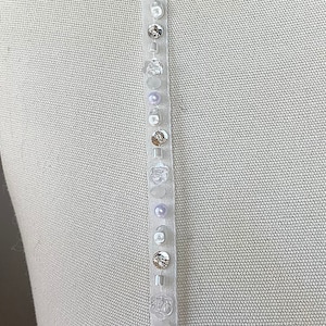 Detachable beaded straps. Spaghetti straps with light ivory beading.