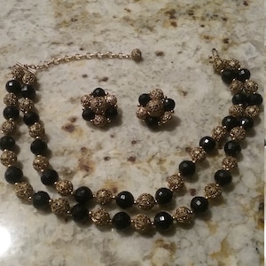Exquisite Black and Gold Tone Filigree two-strand Adjustable Bead Necklace and Matching Clip On Earrings Lisner
