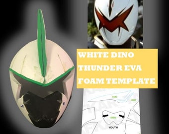 May include: White Dino Thunder Eva foam helmet template. The template includes a side view of the helmet, a front view of the helmet, and a close-up of the mouth area. The template is labeled with measurements in millimeters.