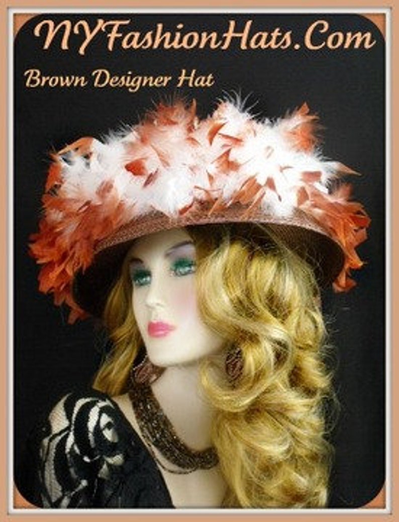 May include: A brown wide-brimmed hat with white and orange feathers. The hat is decorated with a large cluster of feathers on the top.