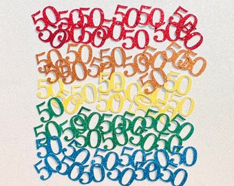 May include: A rainbow assortment of glitter confetti in the shape of the number 50. The confetti is arranged in a rainbow pattern, with red at the top and blue at the bottom.