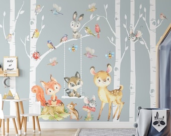May include: A light blue nursery wall mural with a woodland theme. The mural features a birch tree forest with a variety of animals including a deer, squirrel, raccoon, rabbit, and birds. The text "Wild at Heart" is visible on a small wooden shelf.