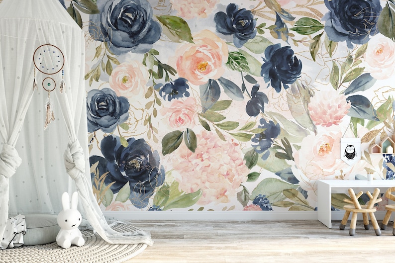 May include: A watercolor floral wallpaper mural featuring a repeating pattern of navy blue and blush pink roses, hydrangeas, and greenery. The wallpaper is perfect for a nursery, bedroom, or living room.