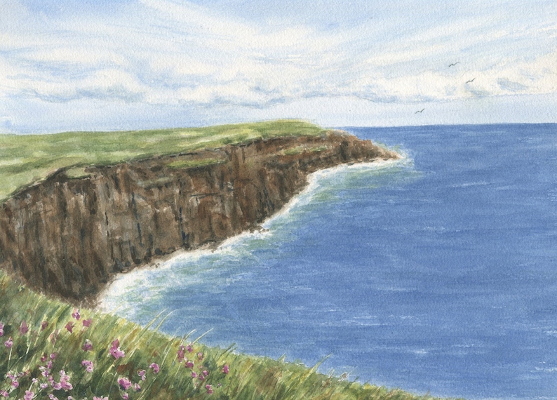 May include: Watercolor painting of a coastal landscape. A green grassy cliff meets the blue ocean under a cloudy sky. Brown cliffs descend to the water's edge, with small pink flowers in the foreground.