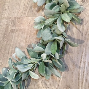 May include: A long garland of artificial lambs ear greenery with soft, fuzzy, light green leaves.