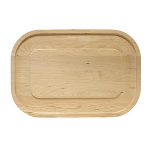 May include: A light-colored wooden serving board with a rectangular recessed center and rounded edges. The wood grain is visible, and the board has a smooth finish. This kitchen item is designed for food preparation and serving.