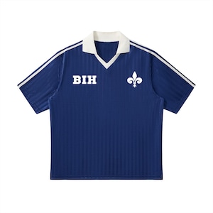 May include: A navy blue short-sleeved shirt with a white collar and white stripes on the sleeves. The shirt features the letters "BIH" in white block letters and a white fleur-de-lis emblem.