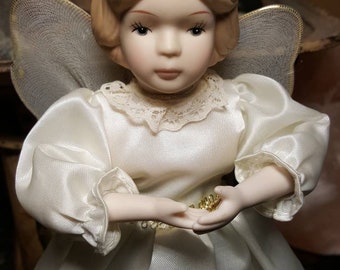 avon snow angel tree topper doll