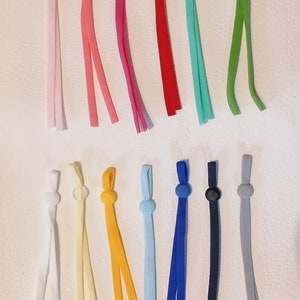 Vorgeschnittene elastische Schlaufen für Bekleidung, Handtücher, Ohrschlaufen etc. Bild 1