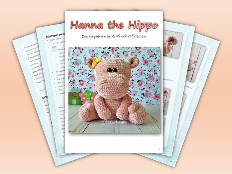 May include: A crochet pattern titled "Hanna the Hippo" by A Pinch of Cotton. The pattern features a plush, pink hippo with a yellow flower on its head. The image includes pattern pages with instructions and a finished hippo toy.