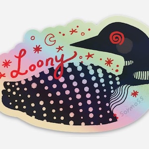 May include: A die-cut sticker featuring a black loon with white polka dots and a red spiral eye. The word Loony is written in red script. The background is a holographic gradient with red stars and a crescent moon. The text Soymoss is visible.