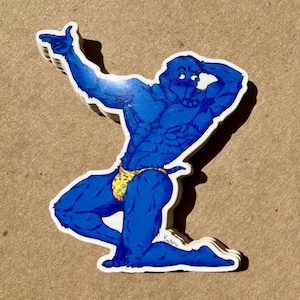 May include: A stack of stickers featuring a muscular blue cartoon character in a yellow and green patterned speedo, striking a pose with one arm raised and the other on its head. The character is kneeling on one knee.