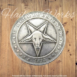 May include: A circular silver-toned metal coin featuring a raised five-pointed star with a goat head at the center. The border includes the text E PLURIBUS UNUM, several small stars, and the year 1893 embossed along the bottom edge.