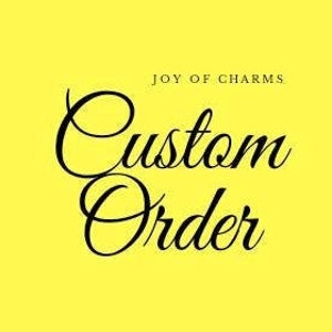 May include: A yellow background with black text that reads "Joy of Charms Custom Order".