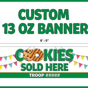 May include: A custom banner with the text "CUSTOM 13 OZ BANNER" in green. The banner is 6 feet long and 2 feet tall. It features the words "COOKIES SOLD HERE" with images of cookies and colorful pennants. The banner also includes the text "TROOP #####".