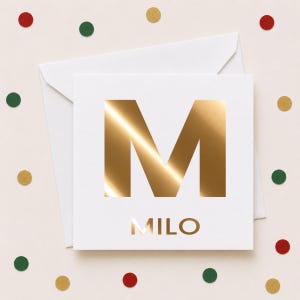 May include: A square white greeting card featuring a large, reflective gold foil letter M in the center, with the name MILO printed in smaller gold foil letters below it, accompanied by a matching white envelope and scattered confetti dots.