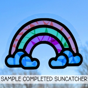 a picture of a stained glass window with a rainbow
