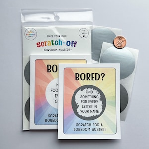 May include: A package of "scratch-off" cards with the text "Make Your Own Scratch-Off - Boredom Busters". The cards have a colorful design with the text "Bored? Find something for every letter in your name. Scratch for a boredom buster!"
