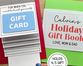 May include: A gift card holder with a blue gift card and the text "GIFT CARD". The holder is red and white with the text "FOR WHEN YOU want to treat yourself". A green card reads "Calvin's Holiday Gift Book".