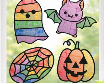 May include: A set of four window clings featuring a rainbow-colored ghost, a purple bat with green wings, a multicolored spider web, and an orange jack-o'-lantern. Each figure has a stained-glass appearance with black outlines on a clear background.