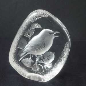Beautiful Mats Jonasson crystal paperweight is in excellent condition being free of chips, scratches, cracks, etc. The paperweight is full lead crystal with a textured outer edge. It is about 4-1/2" tall, 3-3/4" wide and 1" thick. It is signed "MJ Sweden 3501". Made in Sweden