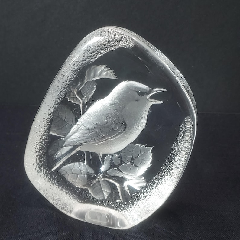 Beautiful Mats Jonasson crystal paperweight is in excellent condition being free of chips, scratches, cracks, etc. The paperweight is full lead crystal with a textured outer edge. It is about 4-1/2" tall, 3-3/4" wide and 1" thick. It is signed "MJ Sweden 3501". Made in Sweden