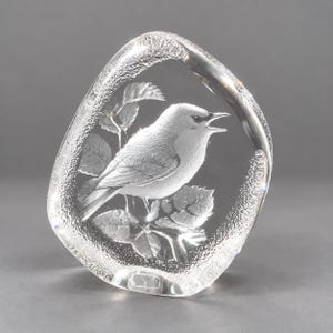 Beautiful Mats Jonasson crystal paperweight is in excellent condition being free of chips, scratches, cracks, etc. The paperweight is full lead crystal with a textured outer edge. It is about 4-1/2" tall, 3-3/4" wide and 1" thick. It is signed "MJ Sweden 3501". Made in Sweden