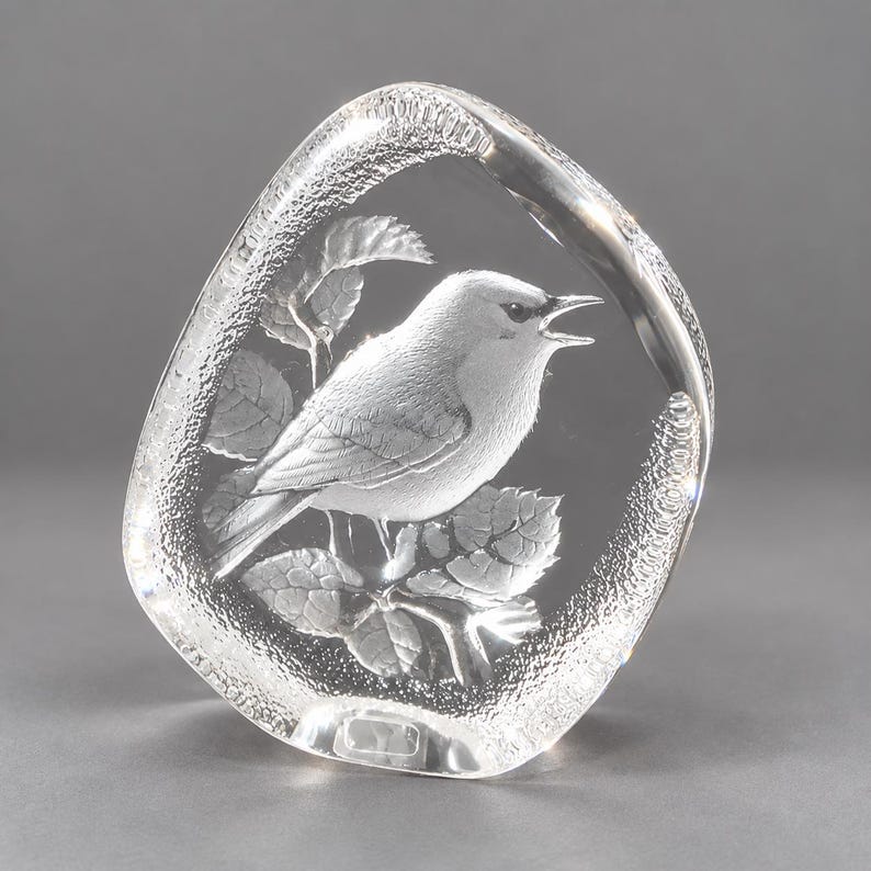 Beautiful Mats Jonasson crystal paperweight is in excellent condition being free of chips, scratches, cracks, etc. The paperweight is full lead crystal with a textured outer edge. It is about 4-1/2" tall, 3-3/4" wide and 1" thick. It is signed "MJ Sweden 3501". Made in Sweden