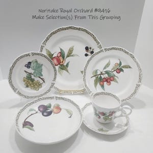 May include: A collection of Noritake Royal Orchard #9416 fine china. The set includes various plates, a teacup, and a saucer, all featuring fruit designs. The rims have a decorative border. The text "Make Selection(s) From This Grouping" is visible.