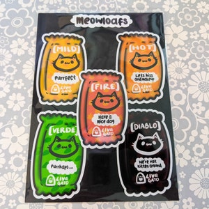 Taco Bell inspired Hot Sauce Sticker Pack – Funny Cat Pun Parody Stickers (Set of 5) – Dishwasher Safe, UV Resistant, Hand-Drawn Art, Gift