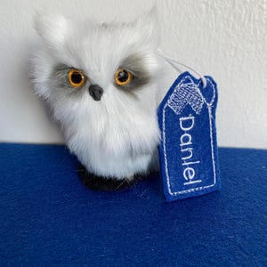 Owl toy with embroidered label